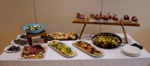 Table of assorted food for a conference lunch.